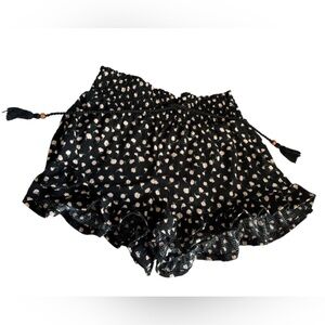 black ruffle shorts with braided beaded drawstring and pink flowers printed